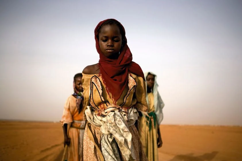 Young girl in a desert landscape